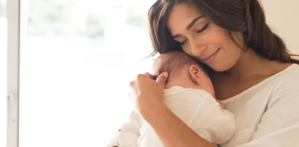 Woman with newborn baby