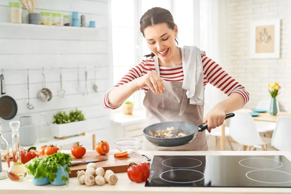 A woman cooking in the kitchen