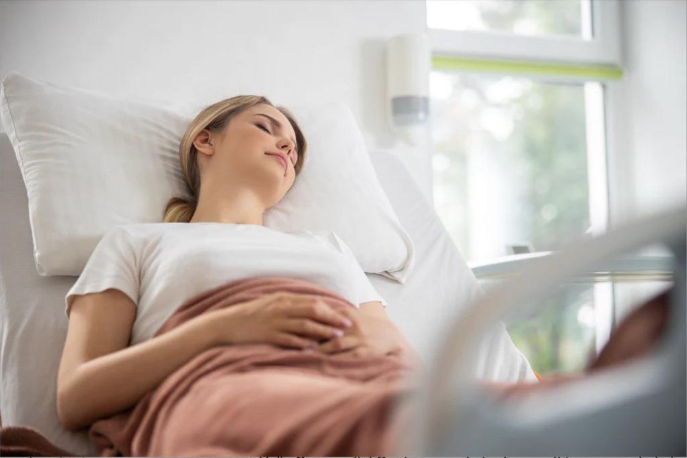 Beautiful young woman sleeping in hospital room